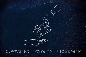 hand giving a gift card with bow, customer loyalty programs - obrazy, fototapety, plakaty