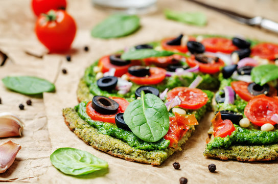 Vegan Broccoli Zucchini Pizza Crust With Spinach Pesto, Tomatoes