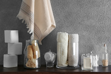Bath accessories on grey wall background