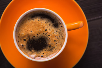 Orange cup of coffee