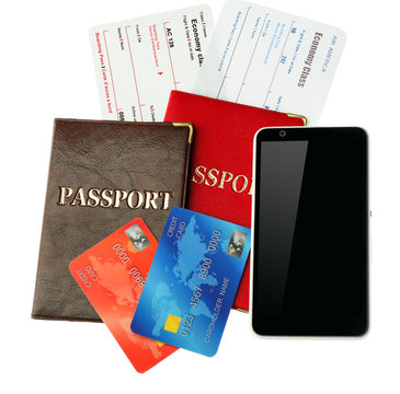 Credit cards with passports and tickets isolated on white