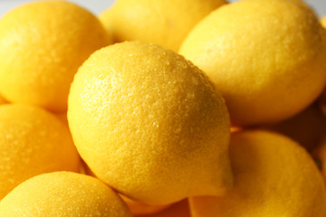 Wet lemons as background