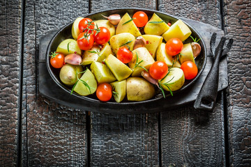 Vegetables with fresh tomato and garlic on barbecue dish