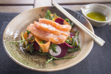 Salmon Sashimi with rainbow salad & dipping sauce 