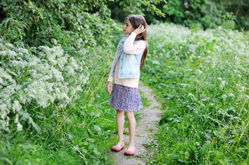 Portrait of a cute little girl outside