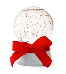 Snow globe with red bow isolated on white