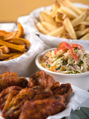 Spread of chicken wings and french fries