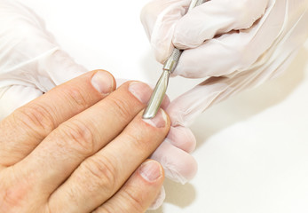 the process of the male manicure in a beauty salon