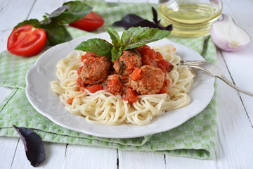 Spaghetti with tomato sauce and meatballs