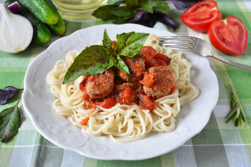 Spaghetti with tomato sauce and meatballs