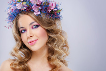Naklejka premium Beautiful young woman in wreath