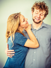 Happy couple man and woman in studio.
