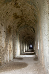 Interior arches in long hallway of the Temple of Jove, Terracina, Italy.
