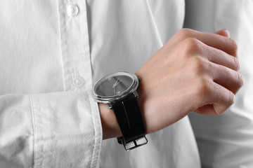 Modern watch on a woman's wrist, close up