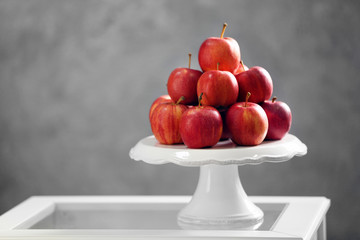 Ripe juicy apples on white plastic tray