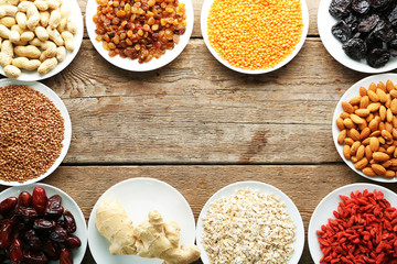 Raw diet food on wooden background, top view