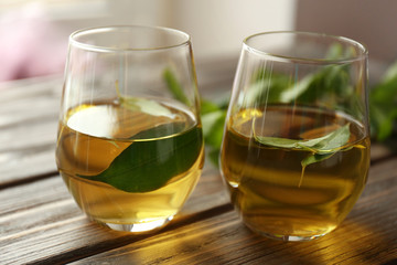 Cups of tea on wooden table