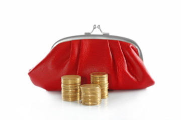 Red purse and stacked coins isolated on white
