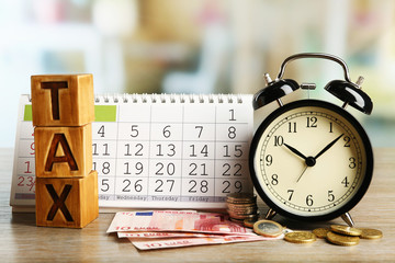 Tax time and alarm clock with euro and calendar