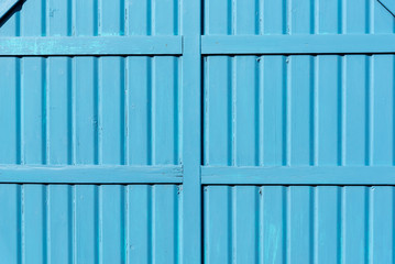 Section of blue panelling from a beach hut, suitable for backgrounds of beach, seaside and summer holiday themes.