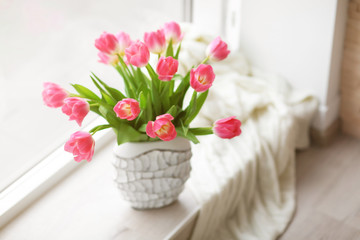 Fresh bouquet of tulips on a windowsill