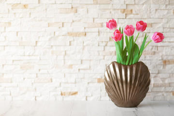 Fresh bouquet of tulips on a wooden table