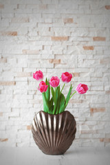 Fresh bouquet of tulips on a wooden table