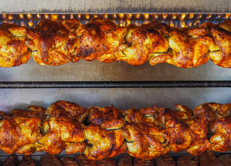 Spit-roasted rotisserie chickens