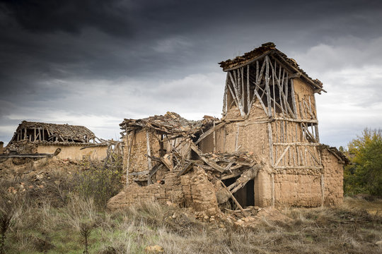 ruins of abandoned rustic houses made of wood and clay - Navapalos, Soria, Spain