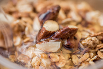 yogurt with granola,honey, almond and fresh berries macro closeup