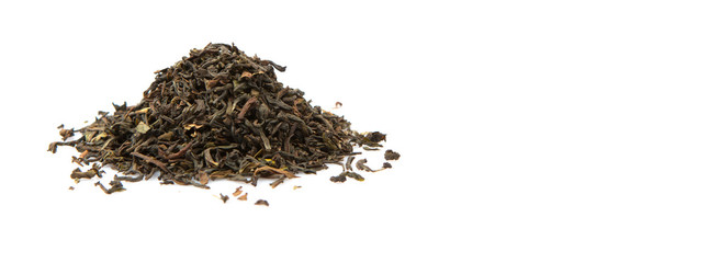 Fototapeta premium Loose dried darjeeling black tea leaves over white background
