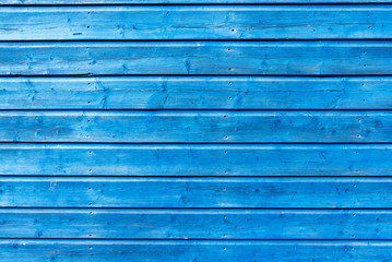 Section of blue wood panelling from a beach hut, suitable for backgrounds of beach, seaside and summer holiday themes. - obrazy, fototapety, plakaty