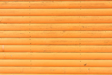 Section of yellow wood panelling from a beach hut, suitable for backgrounds of beach, seaside and summer holiday themes.
