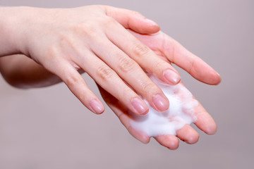 Women washing of hands with soap foam ,nice soft background