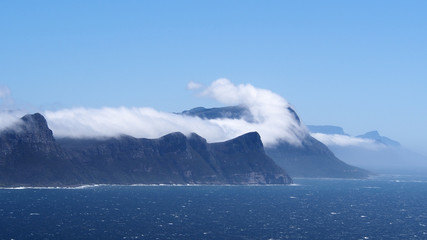 Fototapeta na wymiar Clouds over cliffs and sea