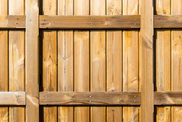 Section of natural colour wood panelling from a beach hut, suitable for backgrounds of gardening themes. The shape could also be adapted as a picture frame.