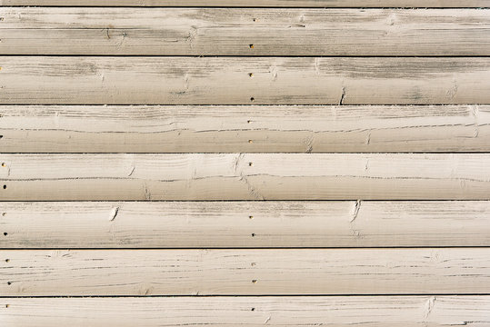 Section of off white wood panelling from a beach hut, suitable for backgrounds of beach, seaside and summer holiday themes. Also suitable for gardening themes.