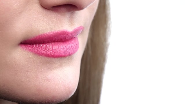 Beautiful sexy pink lips giving kiss. Close up