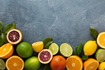 Citrus fruits background with oranges, limes and lemons