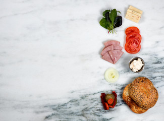 Sandwich ingredients on white marble stone background
