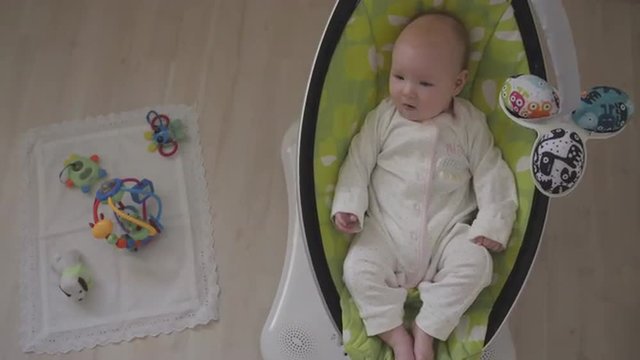 Happy Little Cute Baby Girl Swing in Electric Chair Bouncer  Top View