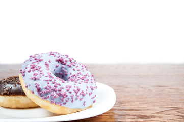 donuts / delicious and unhealthy donuts lying on a table ready to eat
