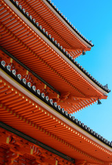 Fototapeta na wymiar Eves and roof tile ends on the famous three-story pagoda at Kizomizu-dera in Kyoto
