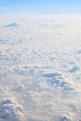 Clouds and sky, aerial view from airplane window.