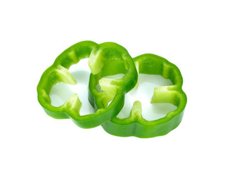 Sliced Green Peppers arranged on white background