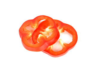 Fresh red bell pepper slices on white backround
