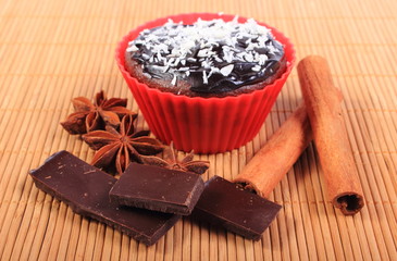 Muffins with desiccated coconut, chocolate, anise and cinnamon