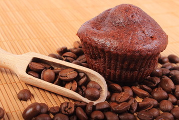 Fresh baked chocolate muffins and coffee grains