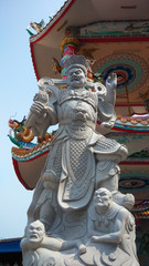 Fototapeta na wymiar Stone statue in Chinese shrine in Thailand.