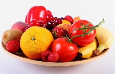 Fototapeta na wymiar Fresh fruits and vegetables on wooden plate